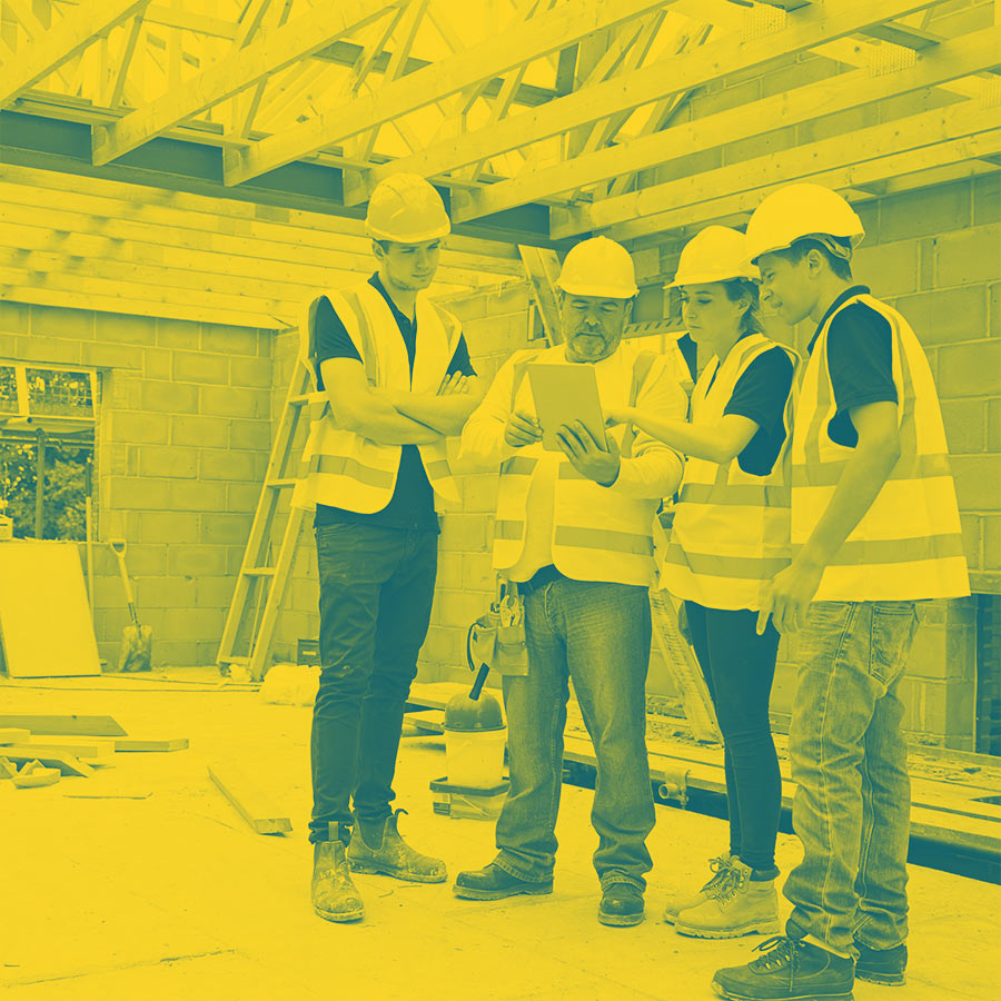 Image of construction workers with a yellow colour filter applied