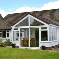 Exterior image of a white home with a rear extension