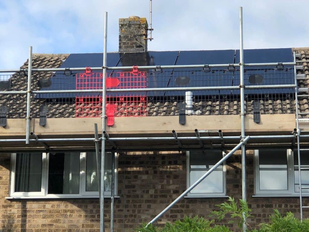 solar panels on a roof mid installation