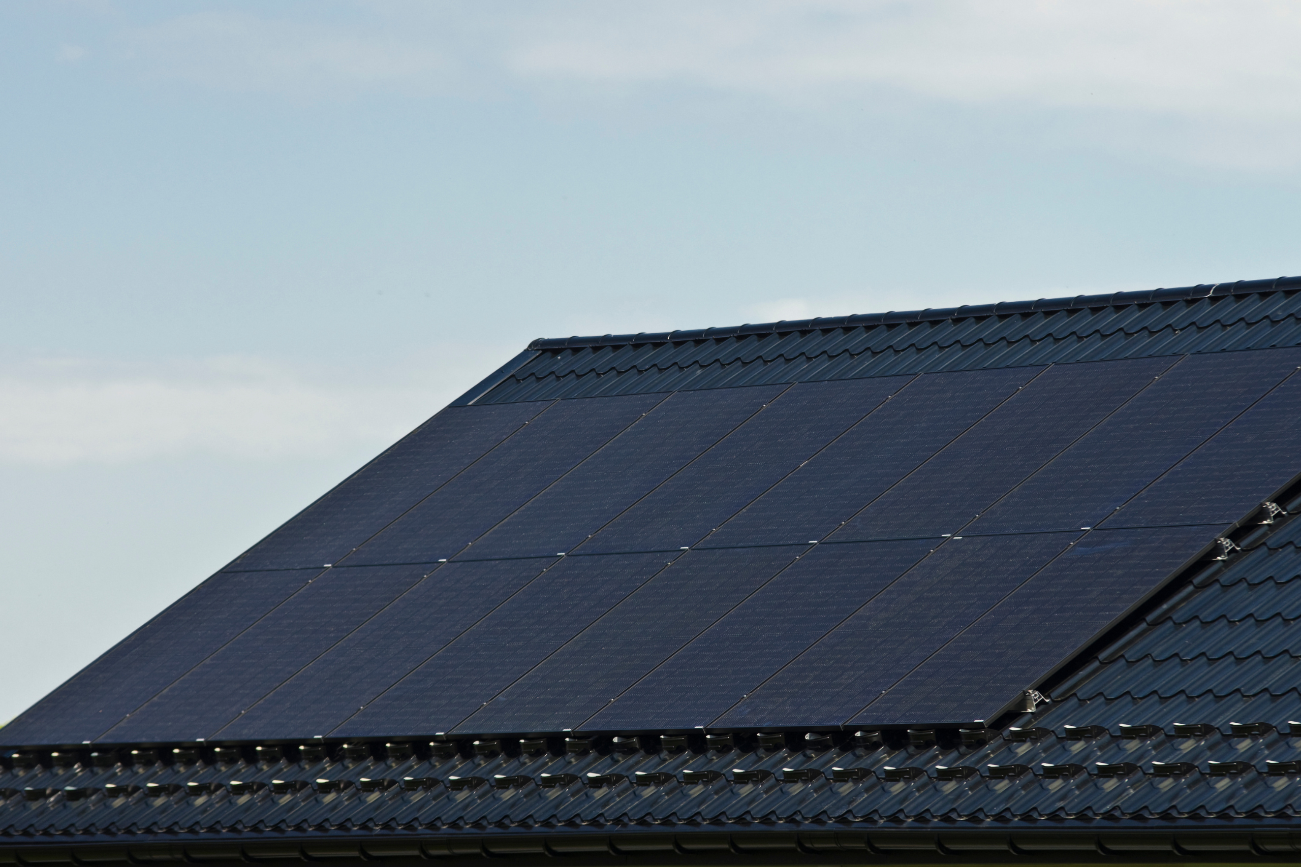 solar panels under a cloudy sky