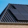 black solar panels on a house rooftop